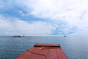Beautiful waterscape of Tonle Sap Lake, with boats, at blue sky with white clouds on background, in Agkor, Siem Reap, Cambodia