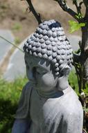 stone Buddha figure in garden