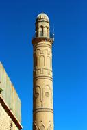 mosque tower on blue sky background