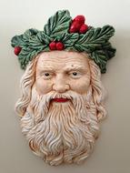 santa claus head in christmas wreath