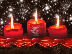 three red christmas candles