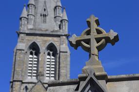 photo of the cross and church tower in Ireland