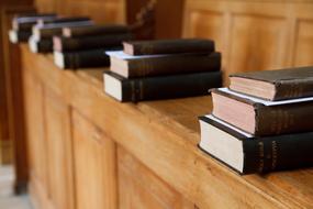 religious books lie on the bench in the church