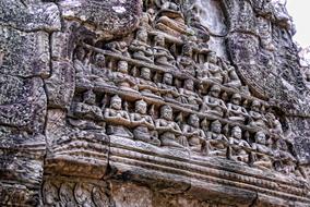 carving on the facade of a building on a temple in cambodia