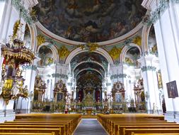 Beautiful and colorful church, with the benches, pillars and light
