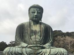 huge buddha statue on a cloudy day