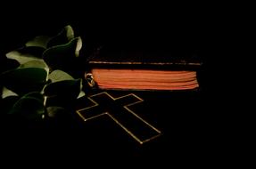 black cross and Bible