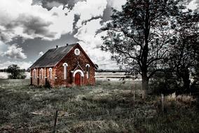 abandoned brick church in countryside