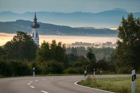 Beautiful road in Diessen, near the Ammersee in fog, Bavaria, Germany