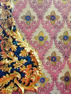 color pattern on the wall of a temple in thailand