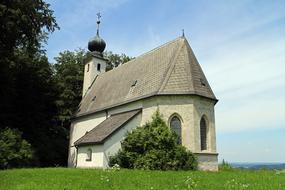 Beautiful Church of St'Johann on the green grass in Siegsdorf, Germany