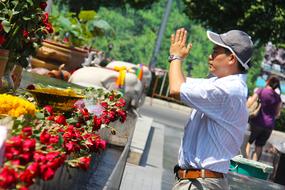 man praying in Ganesha shrine