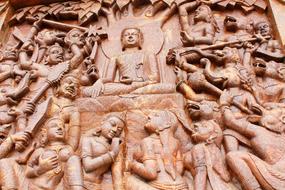 Buddha in Meditation surrounded with people and animals, carving, artwork