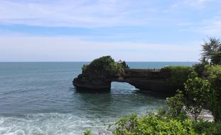 Beautiful Uluwatu temple among the green plants on Bali, Indonesia