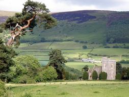 Beautiful landscape of the church among the green fields in Wales