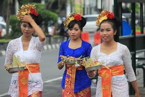 asian girls in national dresses at the ceremony