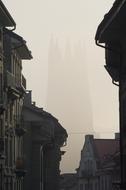 view from the street to the church in a foggy haze