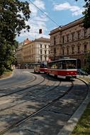 tram on railroad tracks in city