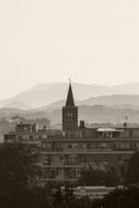 spire on the church against the background of mountains