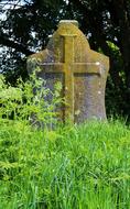 ruined mossy tombstone