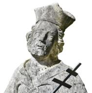 Stone statue of the man with the cross, at white background