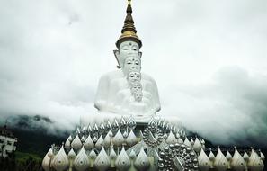 Beautiful statue of Buddha, among the fog, in Khao Kho, Thailand