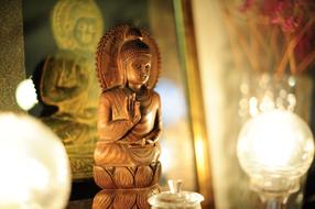 Beautiful and colorful, shiny Buddha statue, among the lights