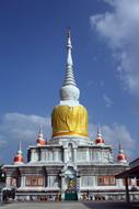 golden and white Buddhist temple in Thailand