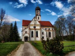 church with a red roof in the countryside in germany