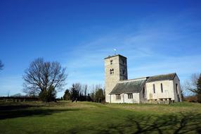 stone church in the countryside on a clear day