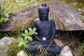 stone Buddha sculpture in garden