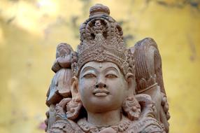 statue in a temple in bali on a blurred background
