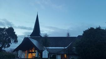 Beautiful Anglican Church, with the lights, among the trees, in New Zealand