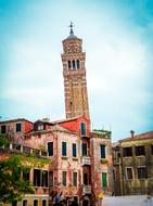 Beautiful leaning building in Venice, Italy, among the colorful houses