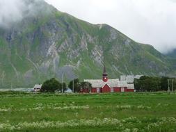 Lofoten church and green grass Norway