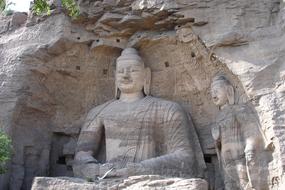 buddha statue near the rock