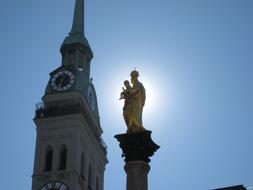 Beautiful and colorful Peter's Church and Marian Column in Munich, Germany, in sunlight