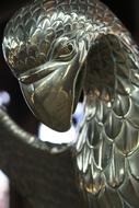 Close-up of the beautiful, colorful and shiny silver bird sculpture