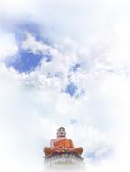 Beautiful, orange Buddha statue at blue sky with white clouds