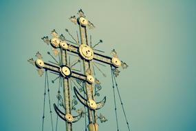 golden crosses against the blue sky