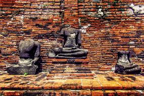 stone ruins near destroyed brick wall