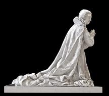 sculpture of a woman praying