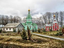 Beautiful and colorful monastery, on the colorful field, among the trees in Voronezh, Russia