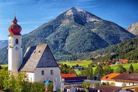 village near the mountains with forest