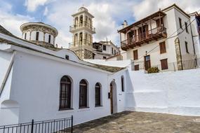 church next to houses in greece