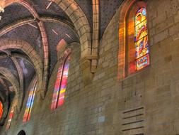 Beautiful and colorful stained glass church windows in the church in Switzerland