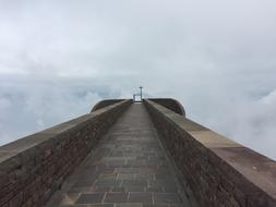 Bottom view of the beautiful brick church at cloudy sky in Switzerland