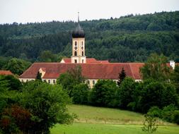 landscape of Monastery Abbey Church in green garden