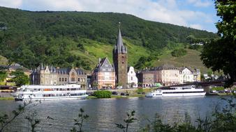 Beautiful Bernkastel Kues and green mountain, on the shore of Mosel in Germany