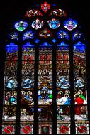 colorful stained glass window in a medieval church in France